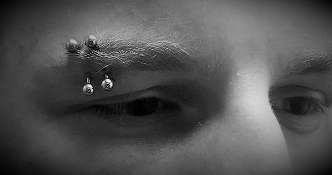 Eyebrow Piercings at Crossroads Tattoo Studio in Denison, TX